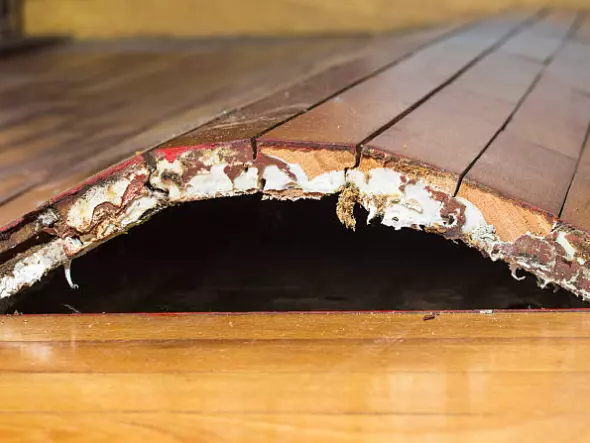How to Fix Water Damaged Swollen Wood Floors?